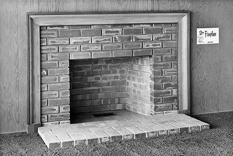 Brick Fireplace with Wood Paneling